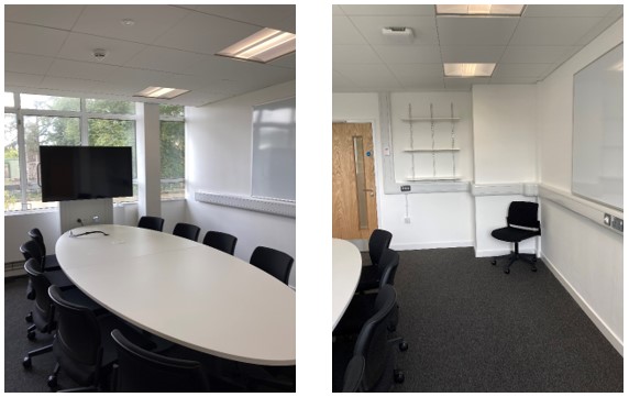 Collaboration Table with Chairs in center of room.